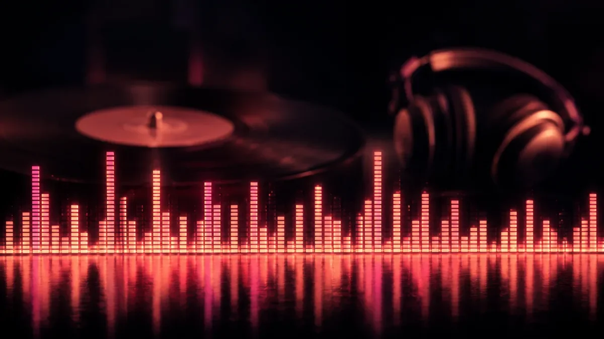 Glowing magenta spectrum bars rising from the bottom of a dark frame with a vinyl record and studio headphones silhouetted behind them